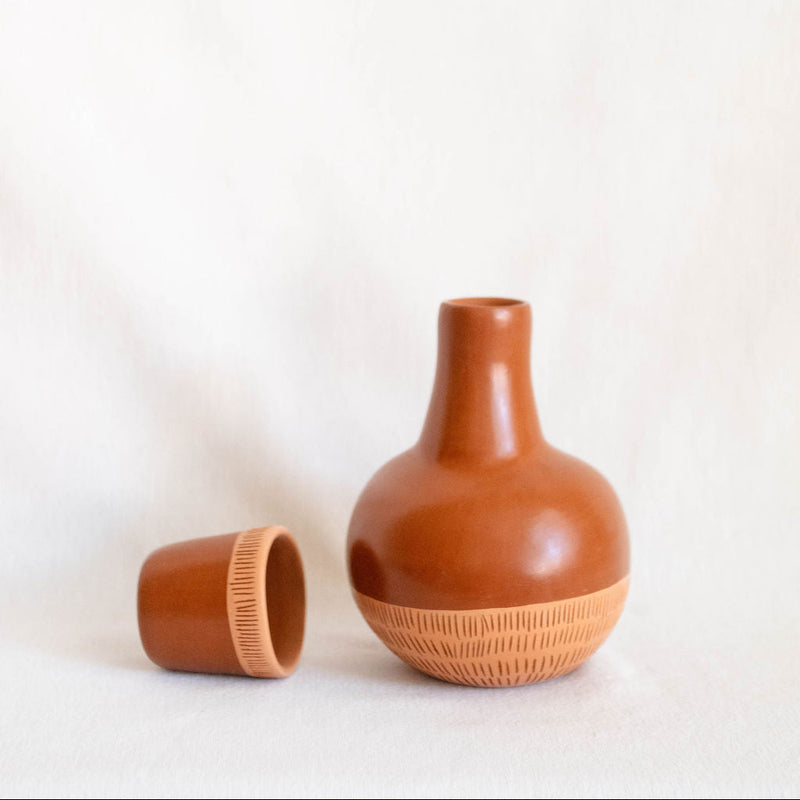 Ceramic vase with textured design on a white background