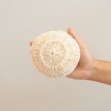 Agave fiber body sponge held by a hand