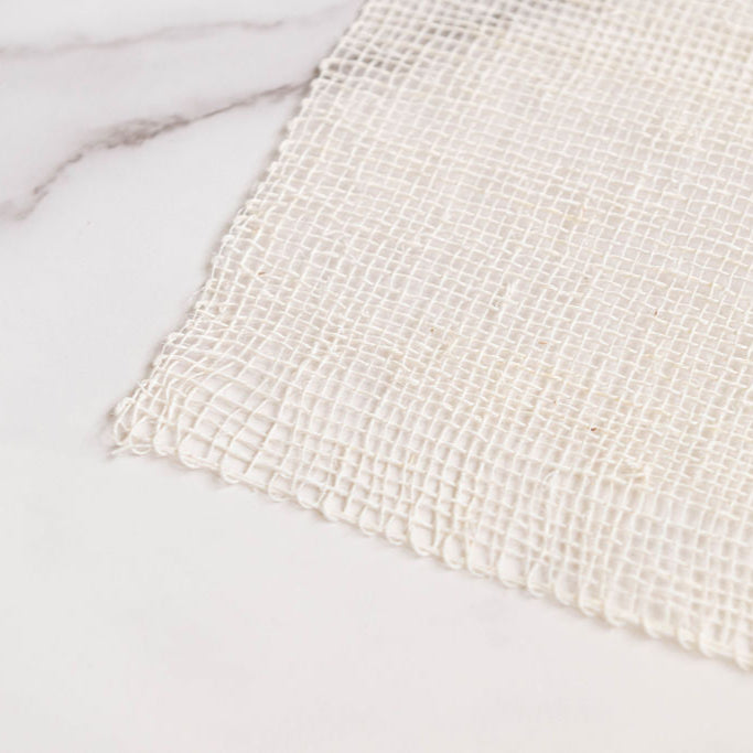 Closeup of Woven Agave Fiber Ayate Washcloth on a marble surface