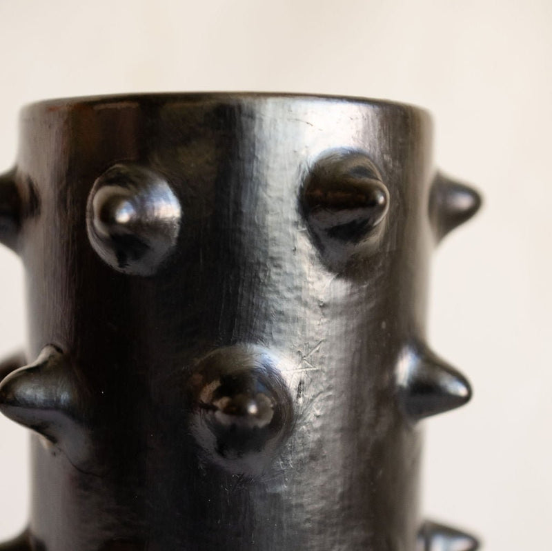 Close up view of a handcrafted Spiked Black Clay Vase made from authentic Mexican black clay (barro negro), featuring a bold, modern spiked design. Perfect for contemporary home decor or as a unique artisanal statement piece.