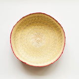 Inside view of orange Woven tortilla warming basket with orange rim on a natural background