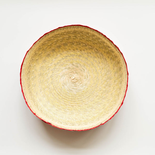Inside view of orange Woven tortilla warming basket with orange rim on a natural background