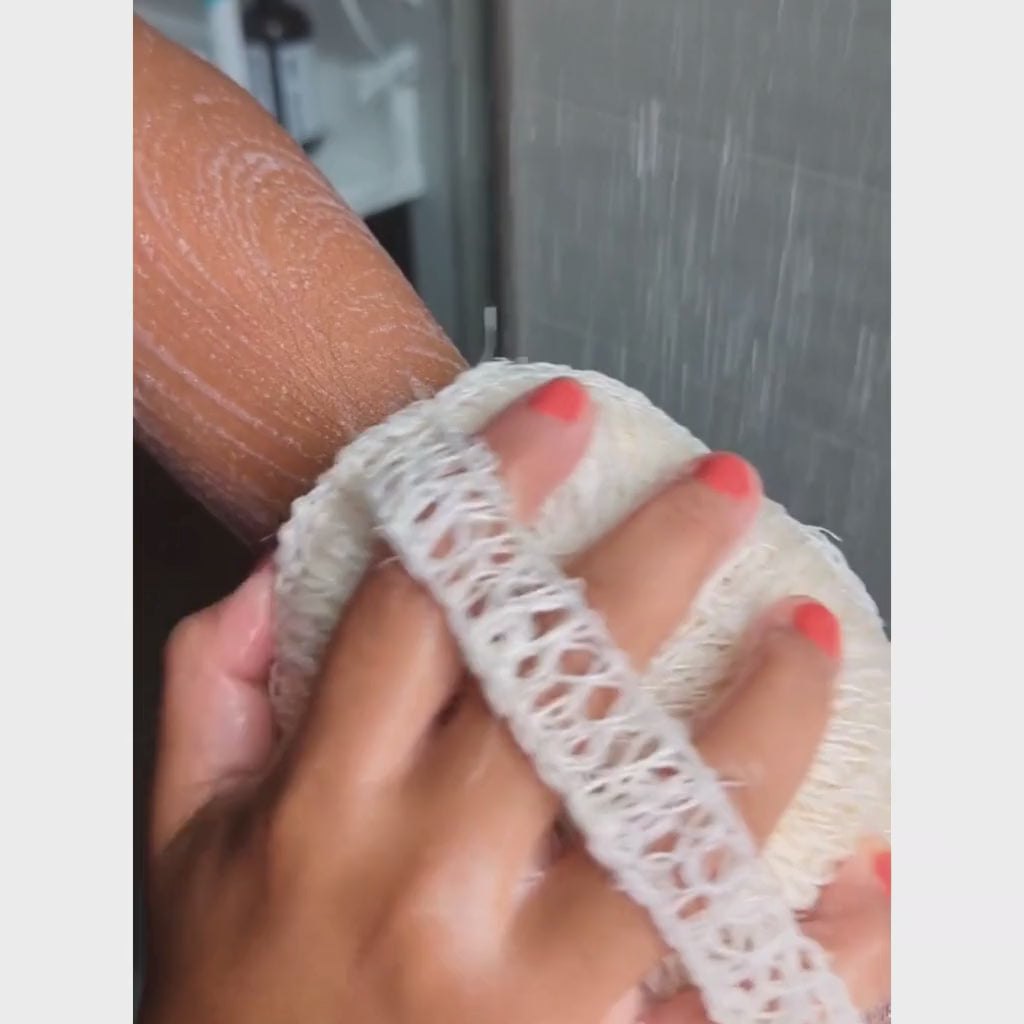 Agave body sponge lathering with soap in shower used to cleanse body