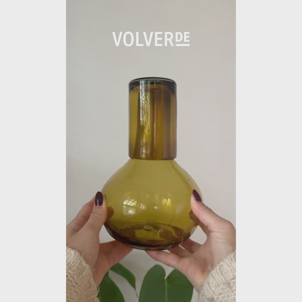 Video showing amber glass round handblown carafe being used with water and sangria