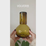 Video showing amber glass round handblown carafe being used with water and sangria