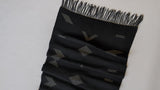 Handwoven black cotton table runner with geometric shapes
