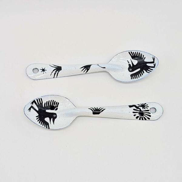 set of two bird-like creatures (nahual) with long beaks and distinctive features on the enamelware peltre metal spoon