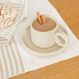 Vanilla Beige Handcrafted Mexican Ceramic Mug and saucer with wide ear handle filled with coffee and cinnamon sticks