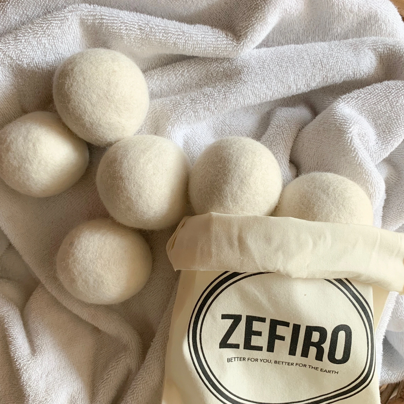Set of 6 premium wool dryer balls by Zefiro, a woman-owned business. Say adiós to single-use dryer sheets and embrace the eco-friendly wool dryer balls, which naturally soften fabrics and reduce drying time. By circulating air in the dyer and absorbing moisture, these wool dryer balls reduce drying time and save energy. 