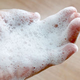 A closeup of the lather produced by Refillable Body Wash in Cucumber Melon scent
