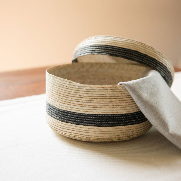 Artisanal tortilla warmer (tortillero) made from sustainably sourced palm sitting on a table