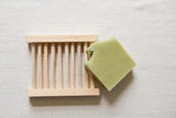 This wood ladder soap dish is handcrafted using upcycled natural wood, without any enamels or solvents, creating a beautiful home for your soap bar. This ladder soap dish allows water to seep out to preserve the life of your soap bars-- they're the perfect addition to your kitchen or bathroom! Artisans partner with local carpenters to upcycle leftover wood to create these beautiful soap dishes, preventing waste from ending up in landfills.