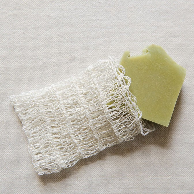 Agave Soap Saver Bag with Drawstring  with a green soap bar inside