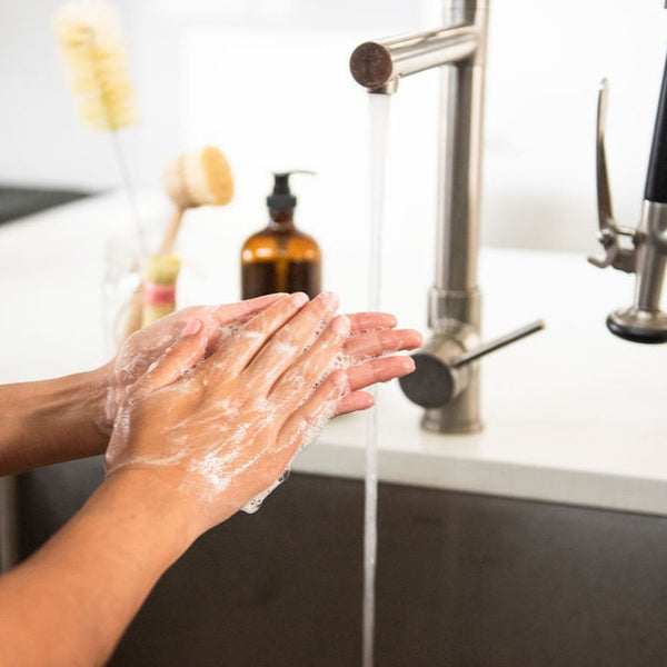 Hands lathering biodegradable hand soap available in zero waste refills delivered right to your doorstep by VOLVERde