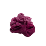 Level up your ponytail or curly girl method look with this smooth, artisanal silk scrunchie. Add a touch of art to your hairdo or around your wrist as a statement piece bracelet. Magenta silk scrunchie naturally dyed with plants. 