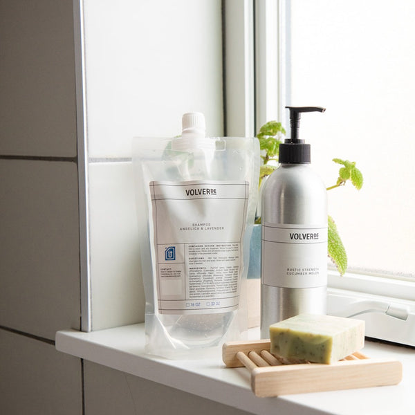zero-waste refillable biodegradable shampoo in aluminum dispenser or refill pouch for a zero-waste bathroom and sustainable haircare