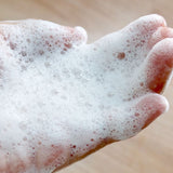A closeup of the lather produced by the refillable cucumber melon Body Wash